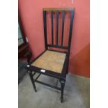 An Art Deco ebonised and rush seated bedroom chair