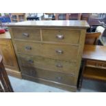 An Arts and Crafts oak chest of drawers
