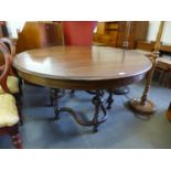 A mahogany extending dining table, with seven leaves