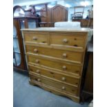 A pine chest of drawers