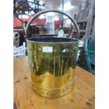 An Arts and Crafts brass coal bucket