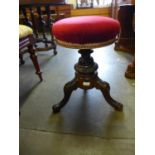 A Victorian mahogany revolving piano stool