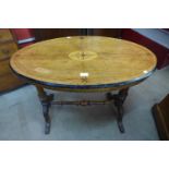 A Victorian inlaid walnut oval stretcher table