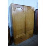 A Victorian pine two door wardrobe
