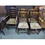 A set of five oak and rush seated ladderback chairs