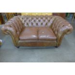 A Chesterfield brown leather settee