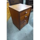 A teak chest of drawers