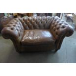 A Chesterfield brown leather lovers seat