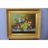 A still life of a fruit and flowers on a shelf, oil on canvas, 50 x 60cms, framed