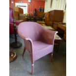 A Lloyd Loom pink wicker chair
