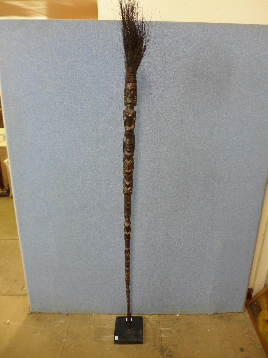 An Indonesian Batak carved staff on stand