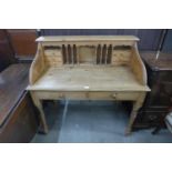 A pine two drawer clerks desk