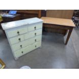 A Victorian pine chest of drawers and a Victorian pine and Formica topped kitchen table