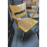 An oak revolving desk chair