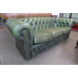 A Chesterfield green leather settee