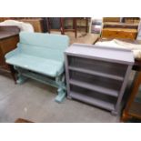 A painted pine settle and a painted open bookcase