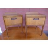 A pair of William Lawrence teak beside tables