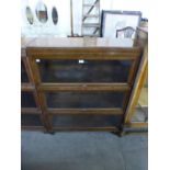 A Globe Wernicke oak three tier sectional stacking bookcase