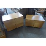 Two teak two door cabinets