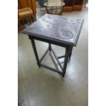 A Victorian Jacobean Revival carved oak drop leaf corner table