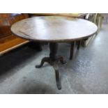 A George III oak circular tripod table
