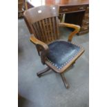 A Victorian oak revolving desk chair