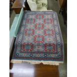A teal ground rug, 170 x 121cms