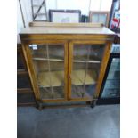 A carved oak two door bookcase