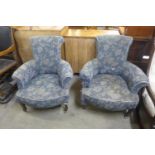 A pair of Edward VII inlaid mahogany and upholstered tub chairs