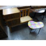 An oak and walnut telephone seat and a painted table