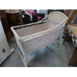 A painted wicker cot