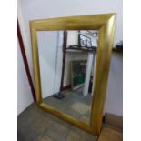 A large gilt framed mirror