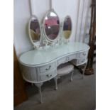 A white and parcel gilt kidney shaped dressing table and stool