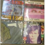 Four LP records, Guns N' Roses (withdrawn sleeve), Frank Zappa, The Best of Bowie and John