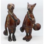 Two novelty cast metal fox hunting themed figures, fox and hound, 17.5cm