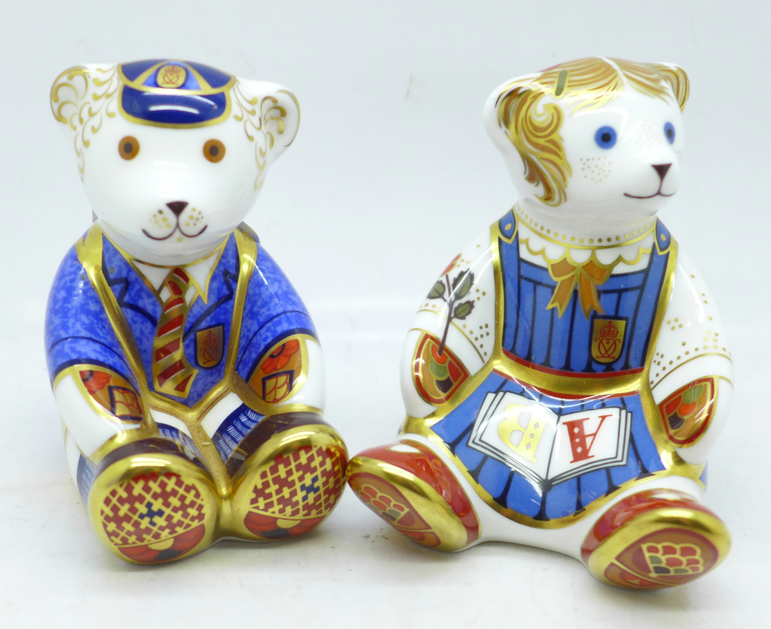 A pair of Royal Crown Derby paperweights, School Girl Teddy and School Boy Teddy, both with gold