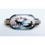 A small silver and enamel brooch, possibly Scandinavian, reindeer winter scene