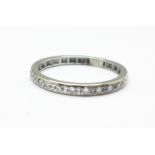 A white metal and diamond half eternity ring, tests as platinum, 3.4g, S