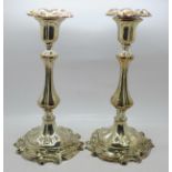 A pair of Sheffield plate candlesticks