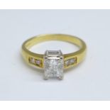 An 18ct gold ring set with 0.6 carat Princess cut solitaire and diamond set shoulders, 3.3g, J