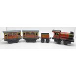 A Brimtoy tinplate locomotive, tender and two carriages