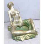 An erotic bronzed figure of a lady