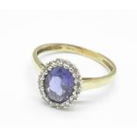 A 9ct gold, tanzanite and diamond cluster ring, 2.0g, O/P