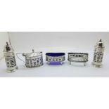 A late Victorian period five piece sterling silver cruet set of open-worked design and form, all but