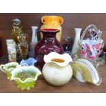 A large collection of coloured glass vases, including Murano, paperweights and bowls