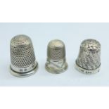 A Victorian silver thimble by George Unite, Birmingham 1886 and two others, one hallmarked and one