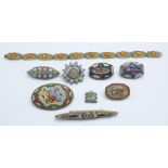 A collection of micro-mosaic brooches and a bracelet
