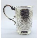 A Victorian embossed silver mug, with inscription dated 1876, London 1874, 187g