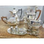 A pair of plated candlesticks, a four piece plated tea service and other plated items