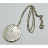 A silver locket and chain, 18g